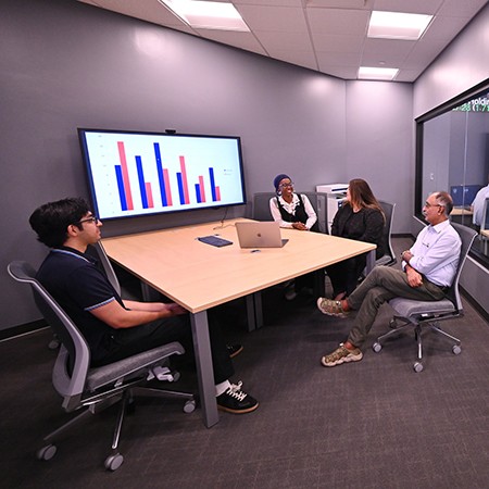 Students and faculty in financial lab