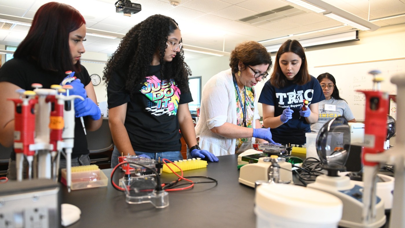 Student in a lab with faculty