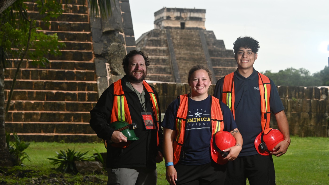 A professor and students pose in front of El Castillo, the largest pyramid in Chichen Itza, an ancient city built by the Mayans and now a revered archeological site in Yucatan, Mexico