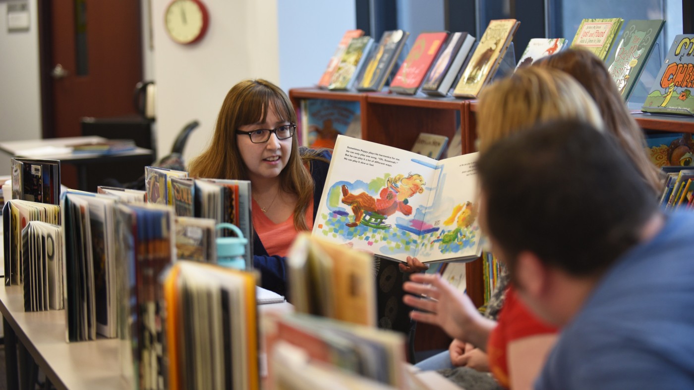Student displaying books