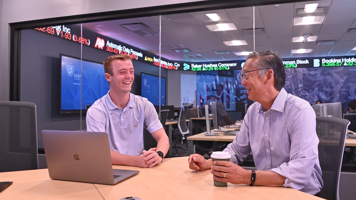 Faculty member and student at desk