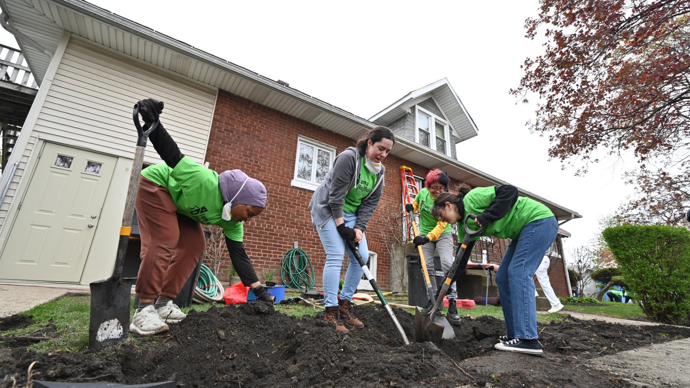 Students digging and preparing soil in service project