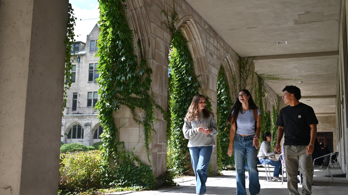Three students in the Cloister Walk