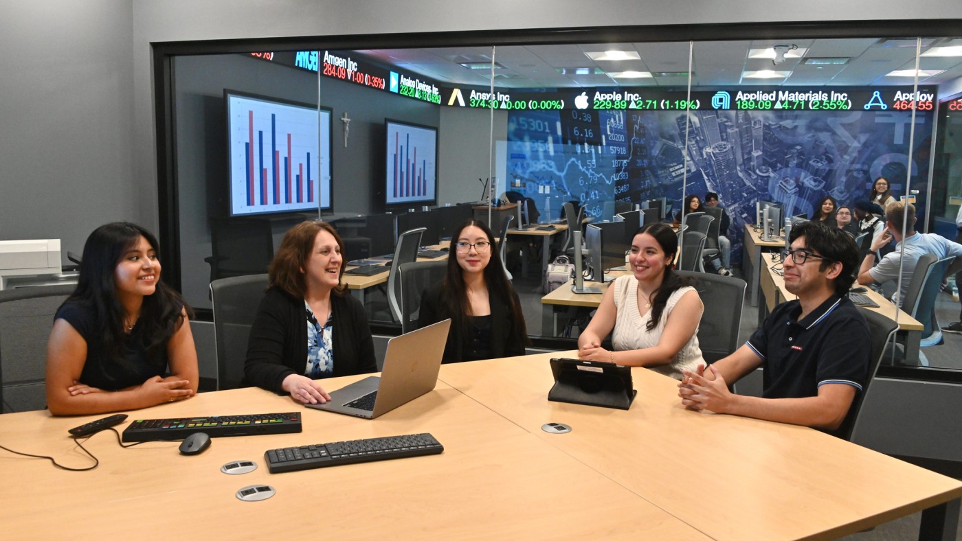 Students and faculty a a table