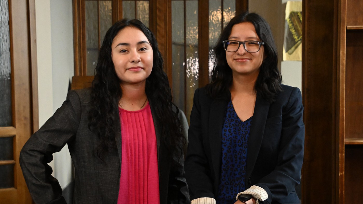 Two female students dressed in business attire