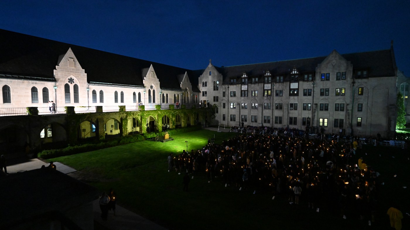 Graduating seniors and their families and friends gather on the Quad the night before Commencement for Candle & Rose, a treasured tradition.