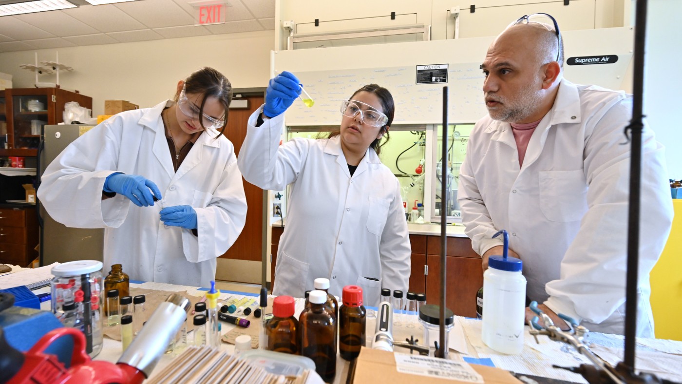 Students and faculty member in science lab