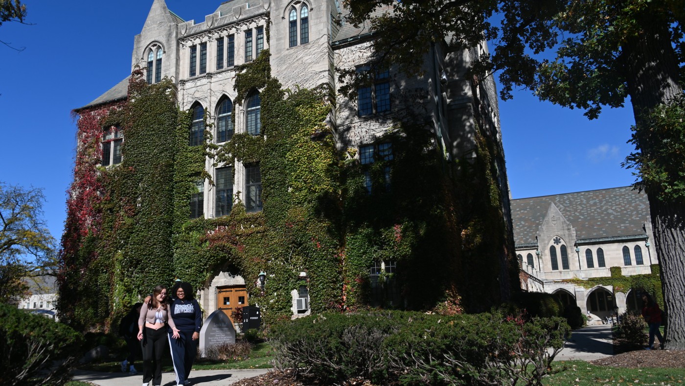 Two students in front of Lewis Hall