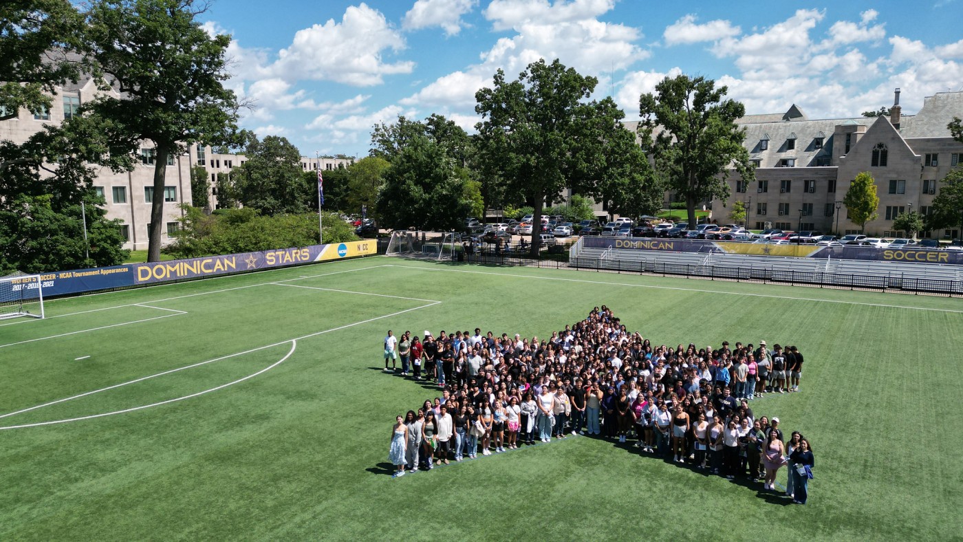 Students forming large star on lawn