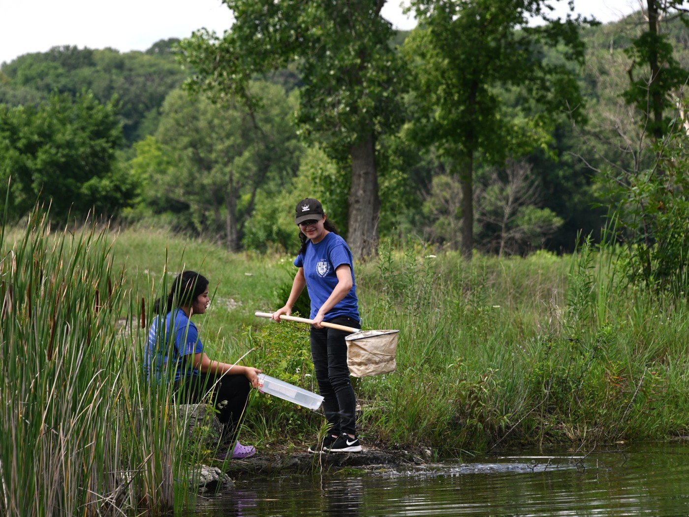 Students at pond with nets