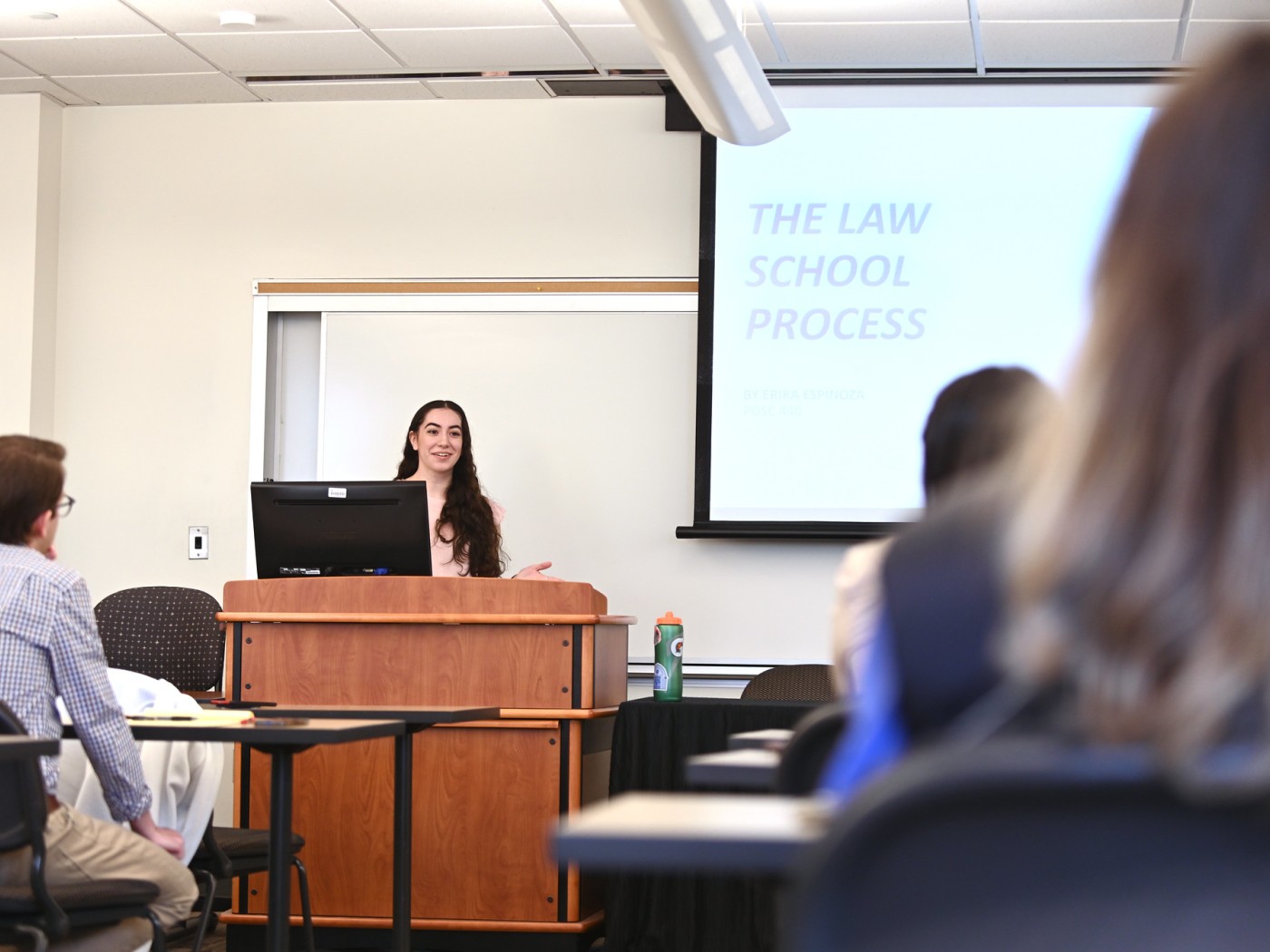 Student presenting at podium
