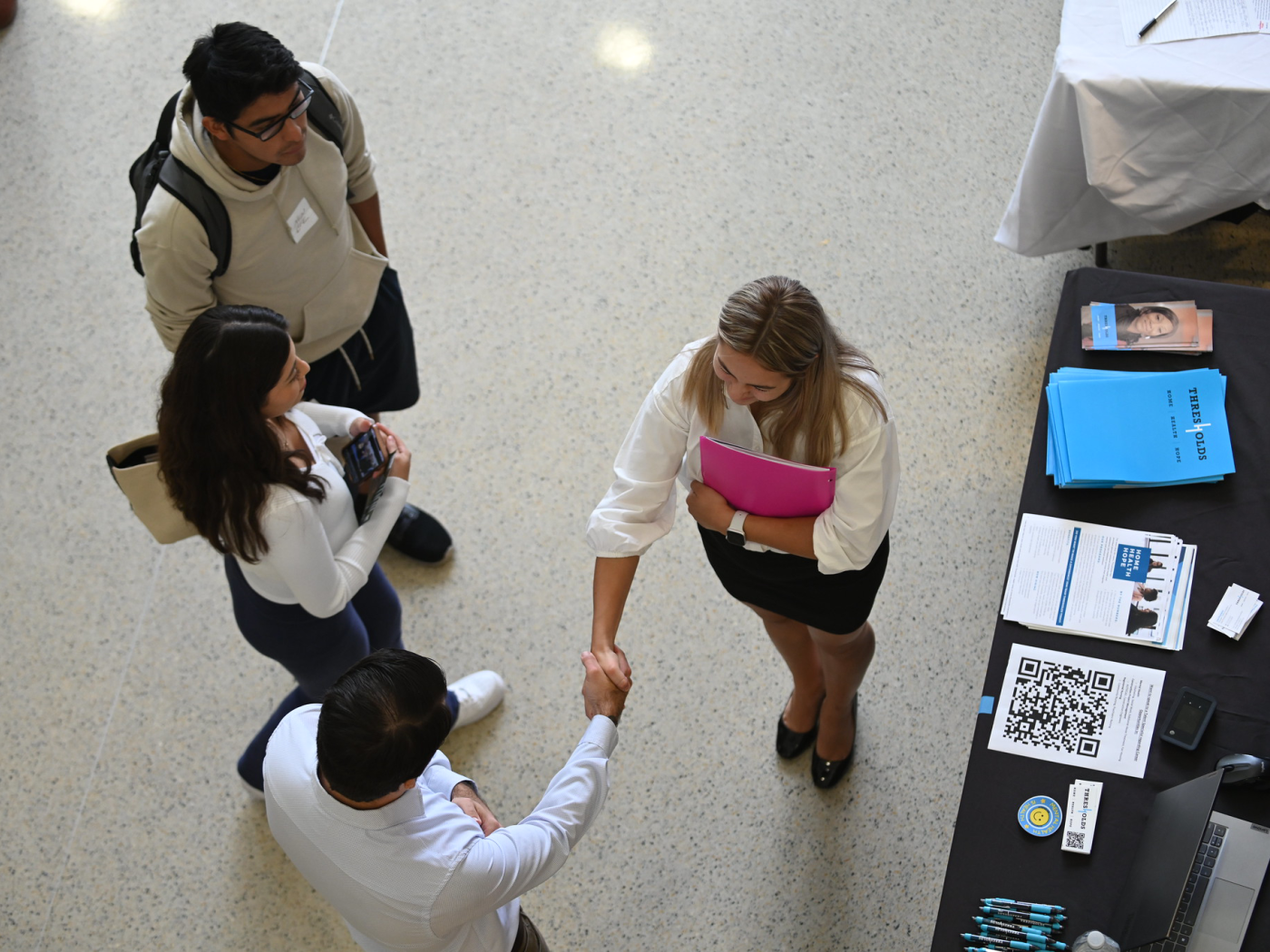 Overhead image of students and employers