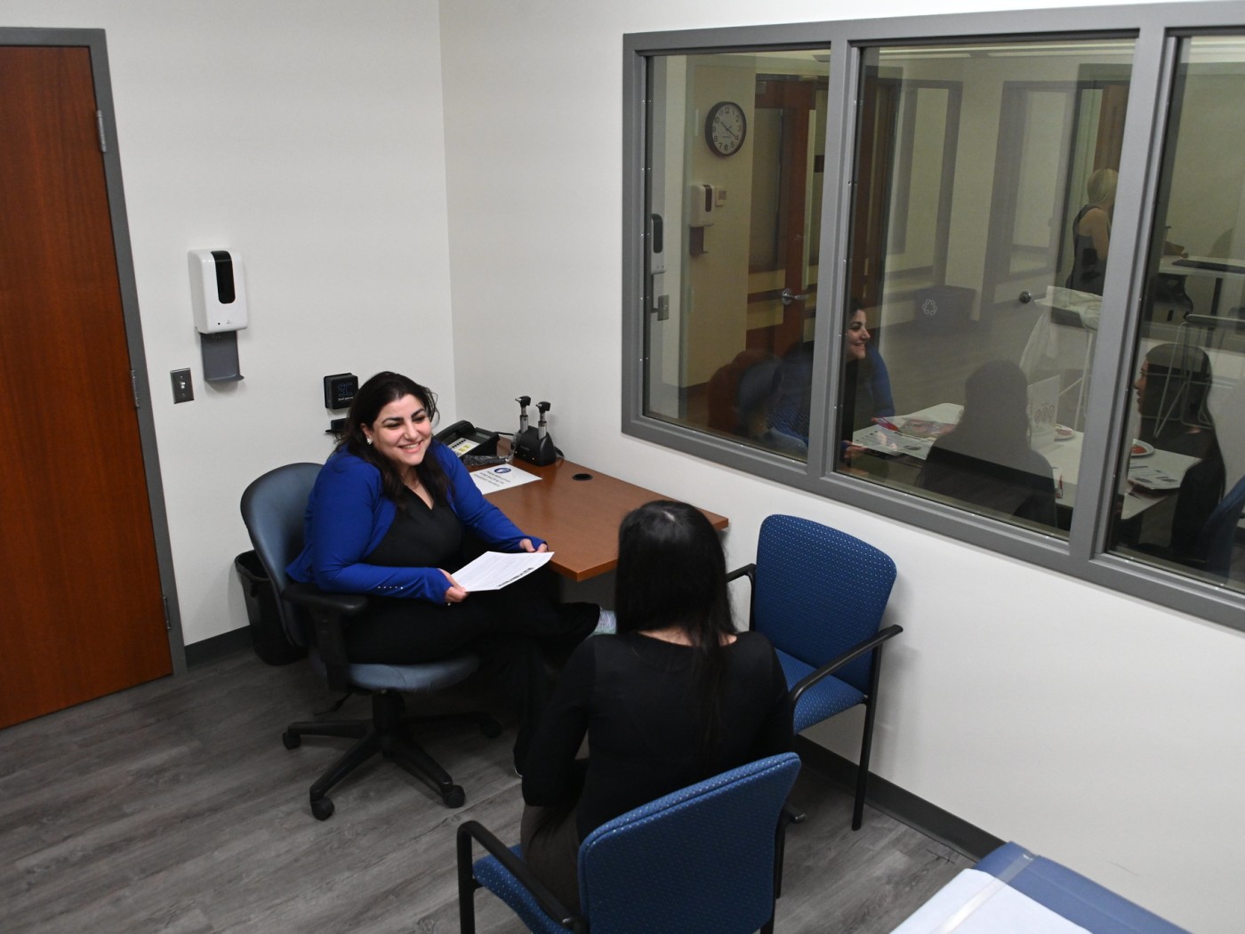Student interviewing in lab