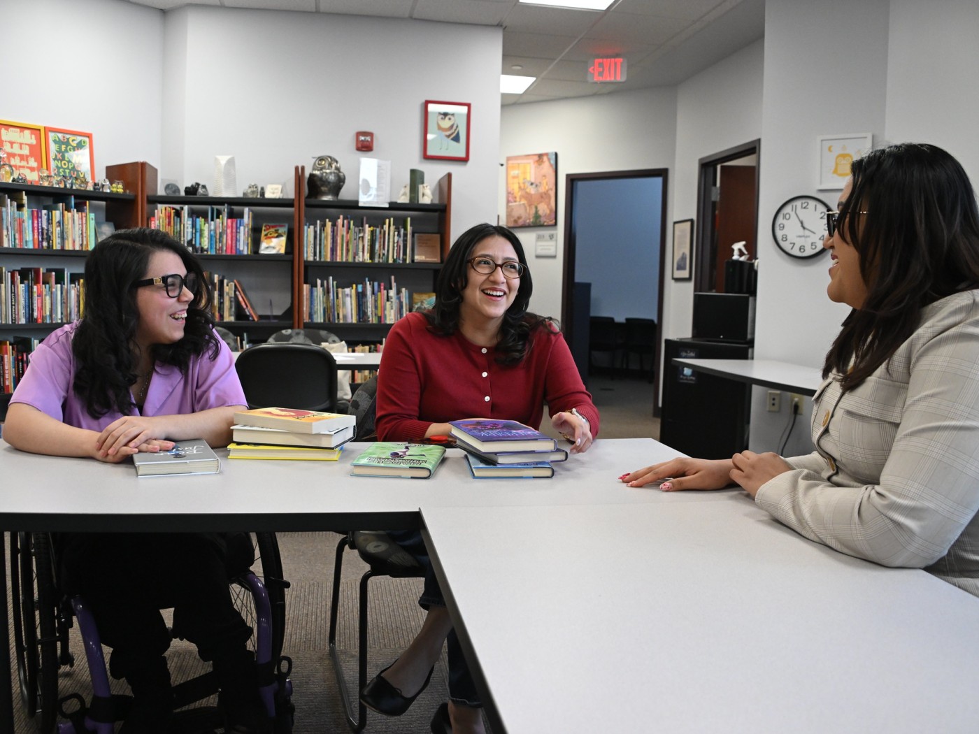 Three female students at a work table
