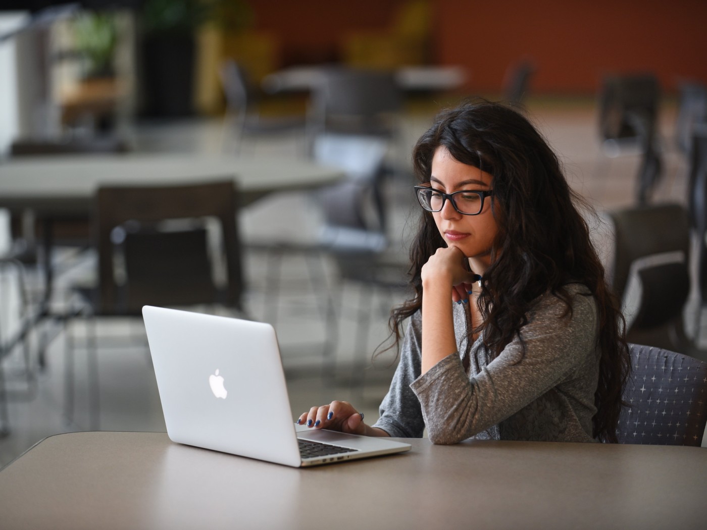 Female student using laptop