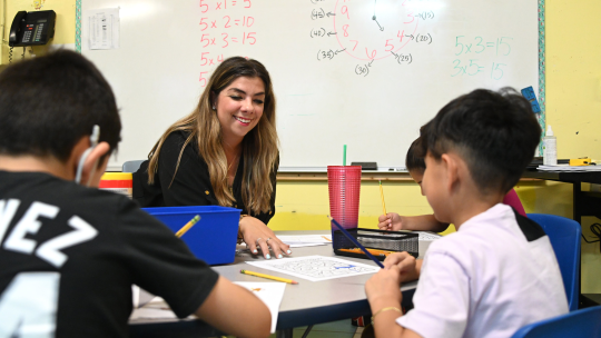 Teacher in classroom with students