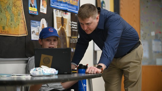 Teacher with young student