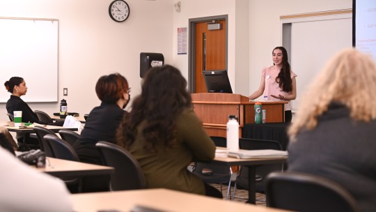 A student presents her research at Dominican University's SI Expo